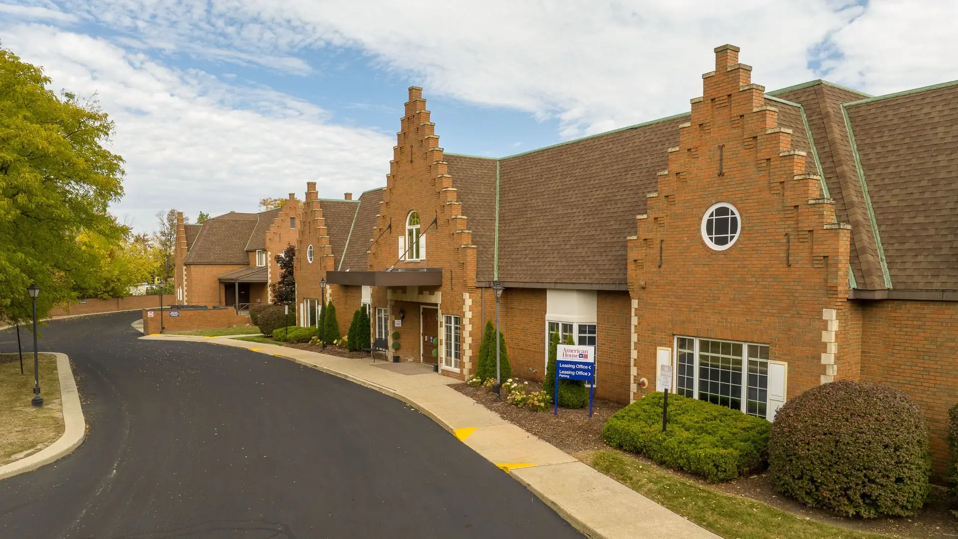 Exterior shot of American House East II, a retirement community in Roseville, Michigan